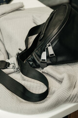 The choice of clothes, the girl's hand in choosing a dress, an outfit on a hanger in the wardrobe in the room, a closet at home. Wardrobe in the house. Clothes for women. Bags. Clothing store.