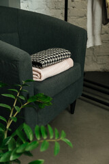 The choice of clothes, the girl's hand in choosing a dress, an outfit on a hanger in the wardrobe in the room, a closet at home. Wardrobe in the house. Clothes for women. Bags. Clothing store.