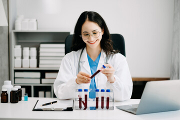 Female scientist researcher conducting an experiment working in chemical laboratory.