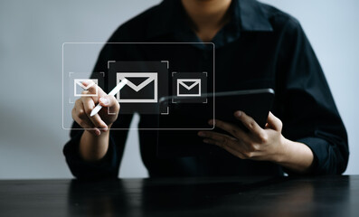 Woman hands using Laptop, tablet typing on keyboard and surfing the internet with email icon, email marketing concept..