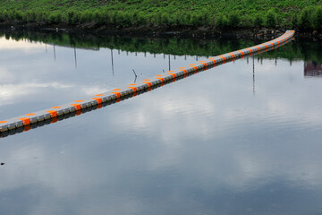 plastic pontoon bridge that can float on a sea or lake. Blue Plastic Modular Floating Dock on the Sea