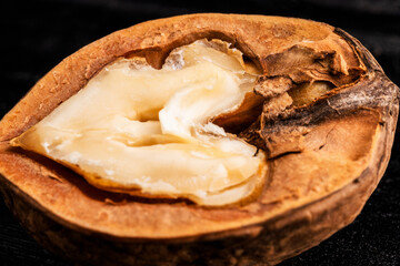 beautiful walnut, macro photo, close-up, on a black background