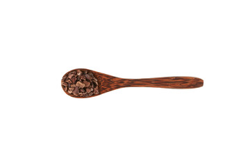 Cocoa nibs in wooden spoon on white background. Crunchy pieces of peeled, crushed and lightly roasted cocoa beans with pleasant chocolate bitterness. Sugar-free product. Design element