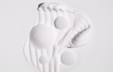 texture foam mousse foam cosmetic smear sample on a light background