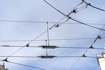 A tangle of wires hanging in mid-air - obrazy, fototapety, plakaty