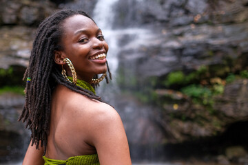 african girl in the waterfall