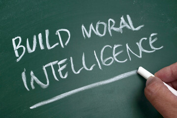Build moral intelligence, quote text written on chalkboard, motivation inspirational