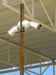 Pole with outdoor security CCTV cameras or surveillance system in an unfinished construction site