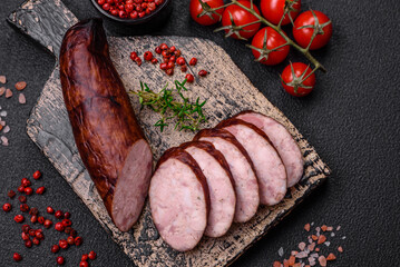 Delicious smoked sausage with salt and spices cut into slices