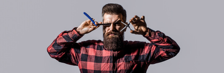 Bearded man, bearded male. Portrait of stylish man beard. Barber scissors and straight razor,...