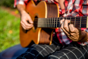 Acoustic guitars playing. Music concept. Guitars acoustic. Male musician playing guitar, music instrument. Man's hands playing acoustic guitar, close up