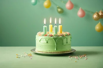 Fotobehang Sweet birthday cake with candles on solid pastel green background. Generative Ai. © kapros76