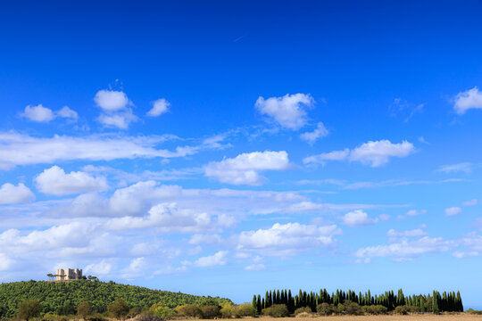 Apulia landscape in Italy: Alta Murgia National Park. In the background Castel del Monte.