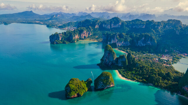 Railay Beach Krabi Thailand, the tropical beach of Railay Krabi, panoramic view of idyllic Railay Beach in Thailand with huge limestone rocks in the blue ocean
