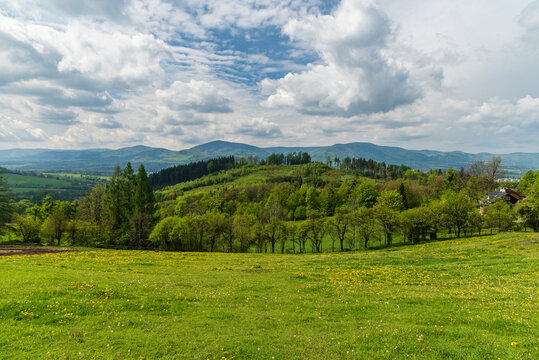 View from Vruzna above Vendryne village in springtime Slezske Beskydy mountains in Czech republic
