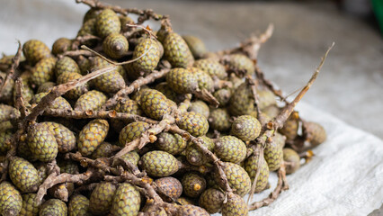 Fototapeta premium Rattan fruits kept in pile at market for selling.
