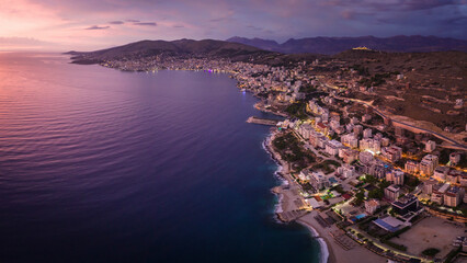 Aerial view of the coastal city of Saranda at sunset, Albania.