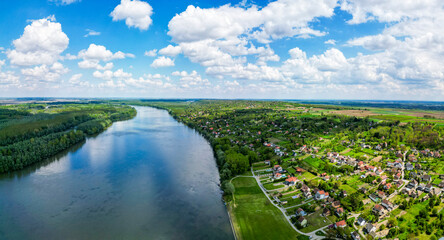 Aerial view of Aljmas small town along the Danube river dividing the border between Croatia and Serbia, Gornje Podunavlje Natural reserve, Osijek-Baranja, Croatia.
