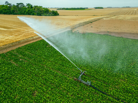 Aerial view of a sprinkler in a field in countryside at sunset, Jouy-en-Pithiverais, Loiret, France.