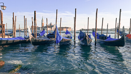 Beautiful seascape with gondolas on the blue sea water in Venice © Наталья Добровольска