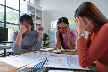 A team of female office workers is stressed over finding solutions to problems in meeting documents. The head of the organization blames the work for being unsuccessful. Discussion concept improvement