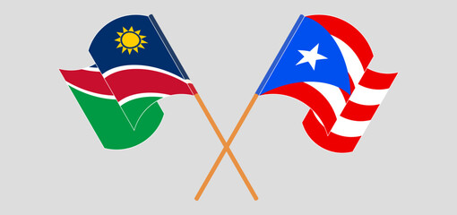 Crossed and waving flags of Namibia and Puerto Rico