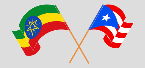 Crossed and waving flags of Ethiopia and Puerto Rico
