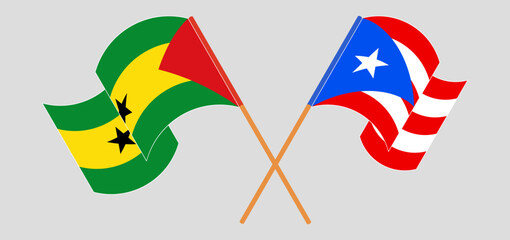 Crossed and waving flags of Sao Tome and Principe and Puerto Rico