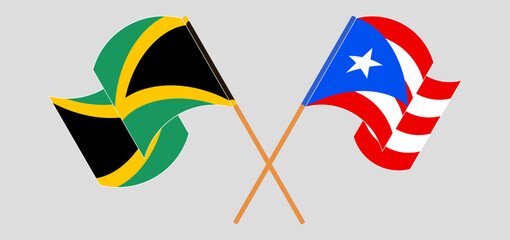Crossed and waving flags of Jamaica and Puerto Rico