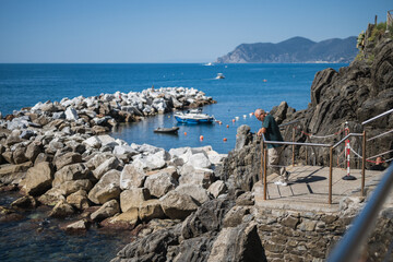 A small wooden boat with a motor in a quiet sea harbor - private transport for fishermen