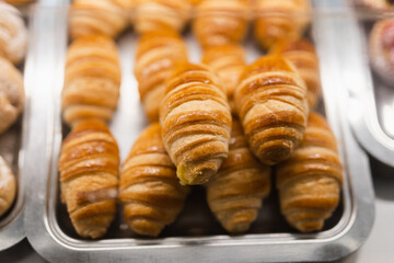Lots of fresh pastries and desserts on the bakery and store counter - craft sweets
