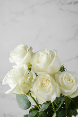 white roses with droplets on a light background