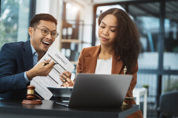 Legal counsel presents to the client a signed contract with legal law. justice and lawyer concept in office.