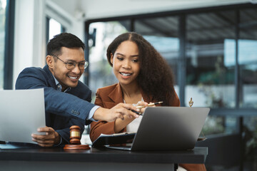 Legal counsel presents to the client a signed contract with legal law. justice and lawyer concept in office.