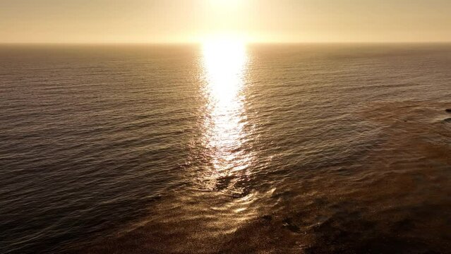 Aerial Shot of Ocean Horizon at Sunset Light