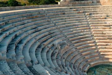 Old ancient amphitheater, stone stairs with stone seats in ancient city Patara