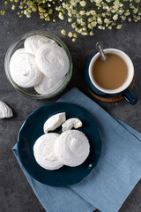 French dessert Meringue prepared from whipped with sugar and baked eggs.A cup of home-made meringues
