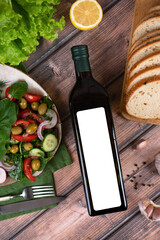 olive oil in a bottle on a white background top view.