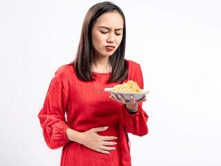 A portrait of a happy Asian woman wearing a red dress, posing hungrily and about to eat noodles. Isolated against a white background.