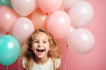 Happy blonde little girl excited looking up in the balloons