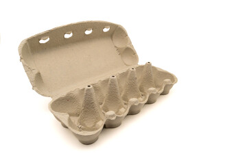 Wide open empty egg box for ten eggs, isolated on white with copy space. Carton pack, egg-container for packaging.
