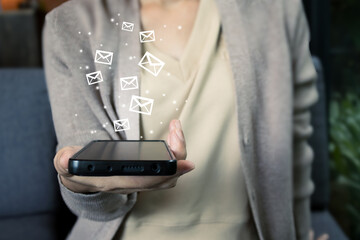 Young woman hold mobile phone. Email marketing.Digital marketing.Technology and futuristic hi-tech technology background concept.