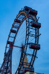 Giant ferris wheel against clear evening sky in Vienna, Austria.