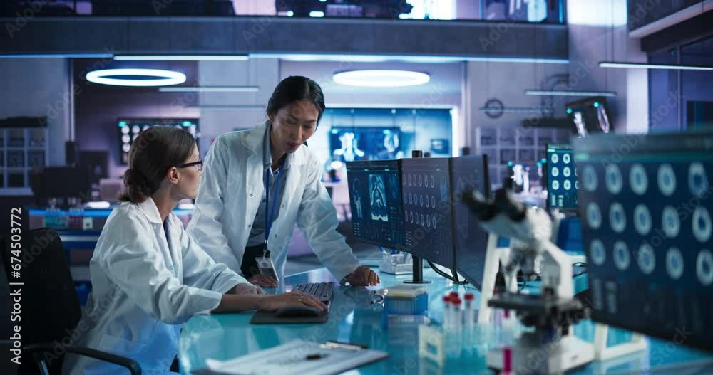 Aufkleber medical research center laboratory: caucasian and asian female scientists talking and using desktop 