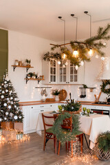 Modern Kitchen Interior with Island, Sink, Cabinets in New Luxury Home Decorated in Christmas Style.