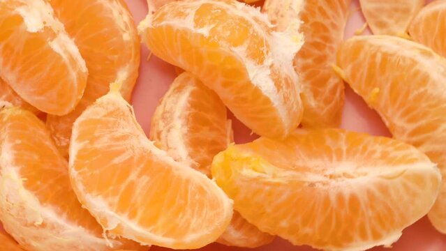 Tangerine slices, rotation in circle. orange fresh peeled tangerines, Turning. selective focus