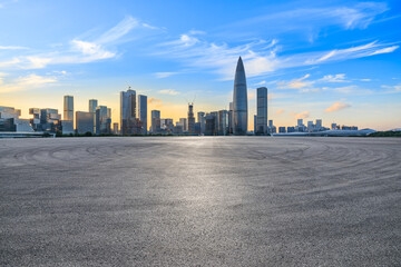 Fototapeta na wymiar Asphalt road and urban skyline with modern buildings at sunset in Shenzhen, Guangdong Province, China.