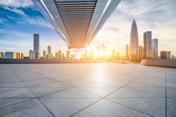 City square and skyline with modern buildings in Shenzhen at sunset, Guangdong Province, China.