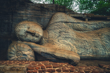 Reclining Buddha statue at Gal Vihara, the Rock Temple, in Polonnaruwa, sri lanka - obrazy, fototapety, plakaty