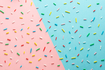trendy pattern of colorful sprinkles for background of design banner, poster, flyer, card over pink and blue, minimal summer concept